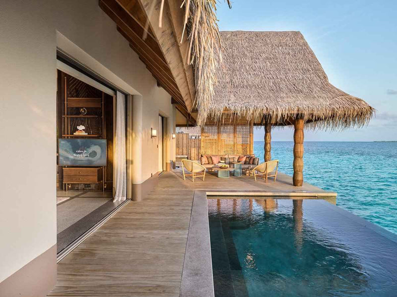 The outdoor deck of a Luxury Water Villa with Pool at JOALI Maldives.