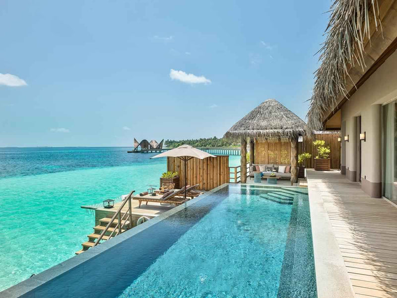 The outdoor deck of a Water Villa with Pool at JOALI Maldives.