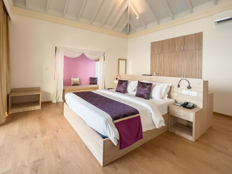 Bedroom of an Ocean Villa with Pool and Slide at Siyam World, Noonu Atoll, Maldives