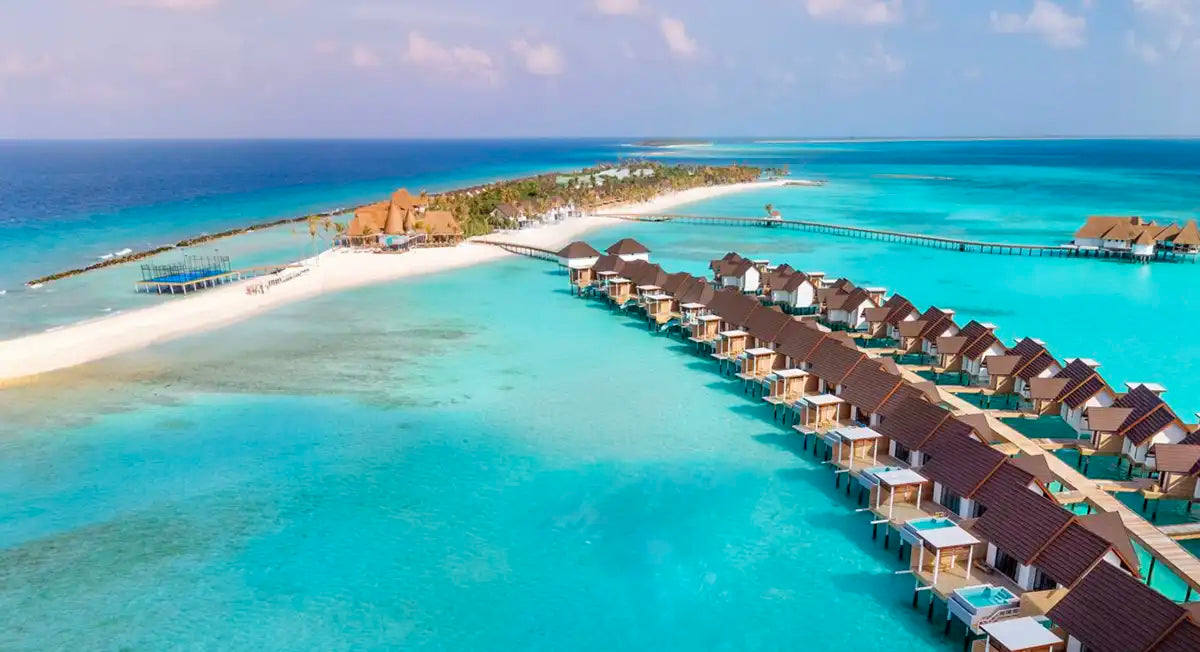 Meyyafushi Maldives from the air, the island, its beach and the overwater villas in Lhaviyani Atoll