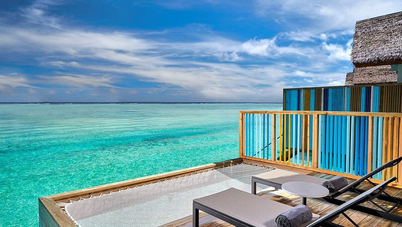 The deck of a Platinum Overwater Villa at Hard Rock Hotel Maldives, looking out over open water.