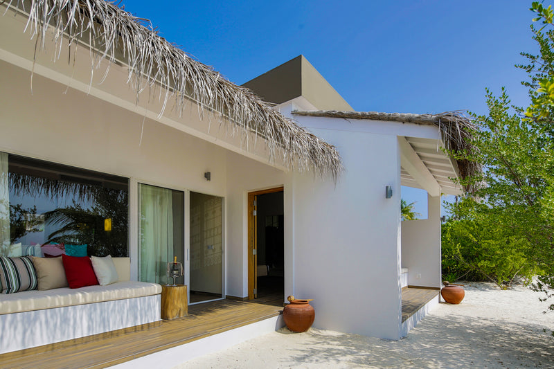 A villa at Cocoon Maldives, seen from the garden.