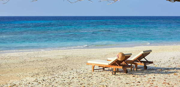 Loungers on the beach at Taj Coral Reef Resort & Spa, Maldives.
