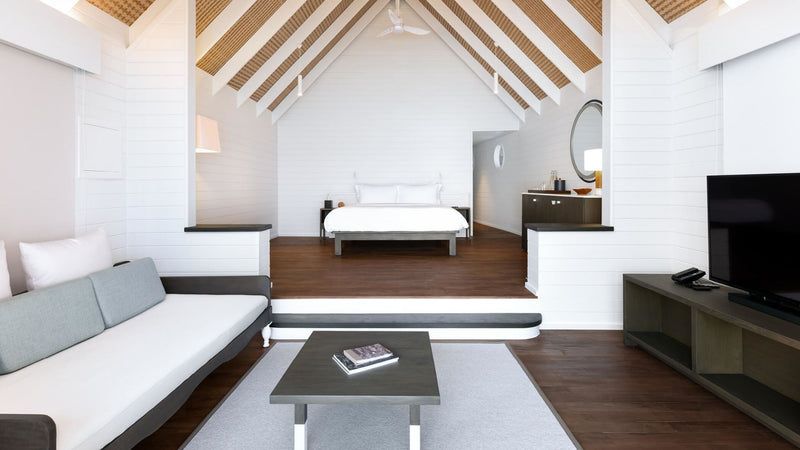 The living room of a Dhoni Water Villa at COMO Cocoa Island.