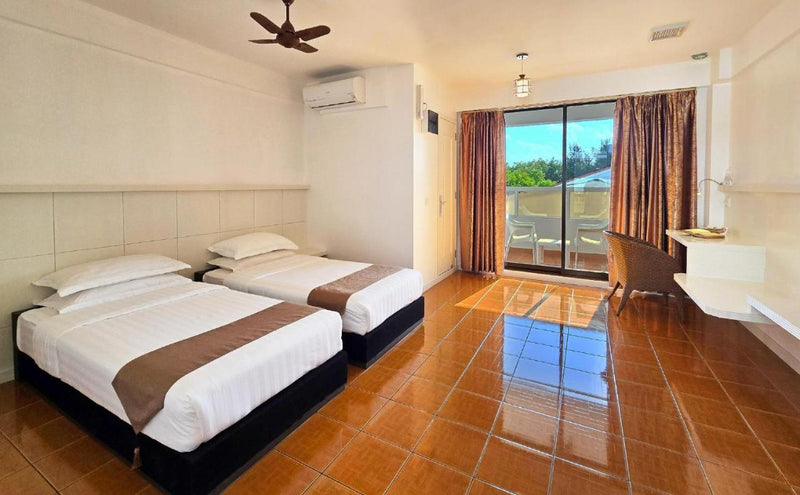 Room at Rashu Hiyaa with a double bed and a view through the window