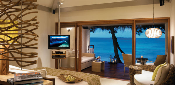 A villa interior looking out to the sea at Taj Coral Reef Resort & Spa, Maldives.