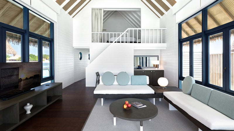 The living room of a Loft Water Villa at COMO Cocoa Island.