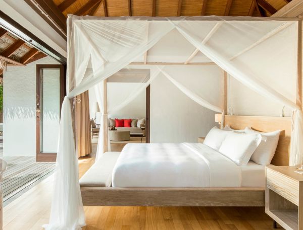 The bedroom of a Beach Villa with Private Pool at COMO Maalifushi.