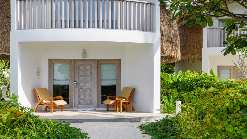 The front of a two-storey Premium Beach Villa at Bandos Maldives.