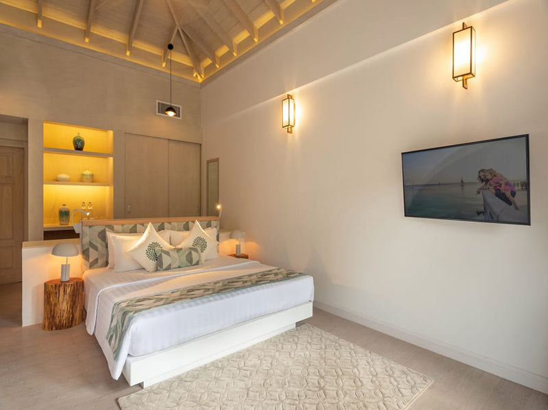 The bedroom of a Beach Villa at Bandos Maldives.