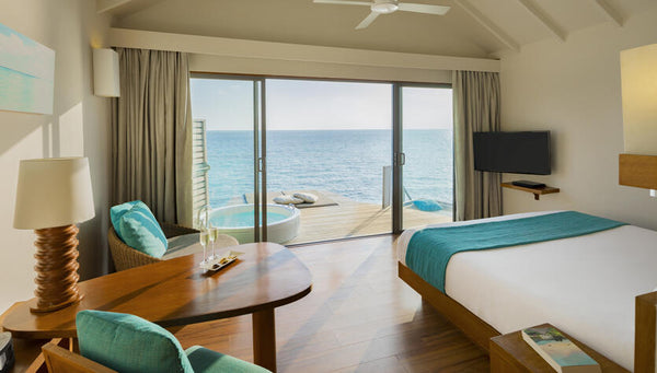 A Premium Deluxe Spa Water Villa at Centara Ras Fushi Resort & Spa Maldives.
