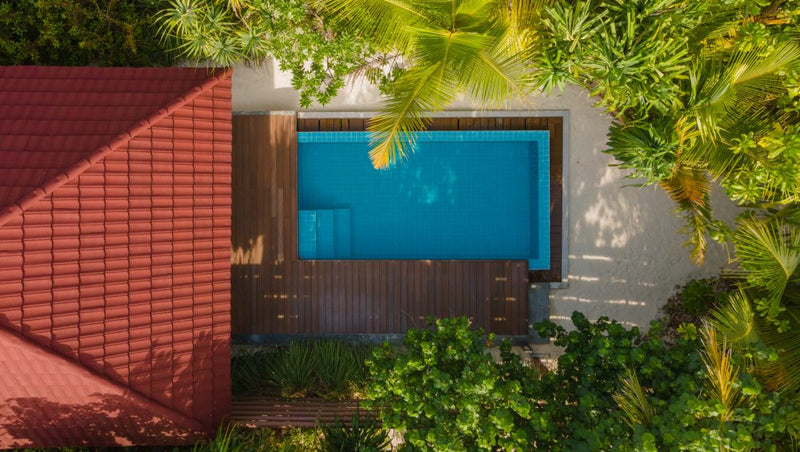 A Pool Beach Villa at Dhigufaru Island Resort.