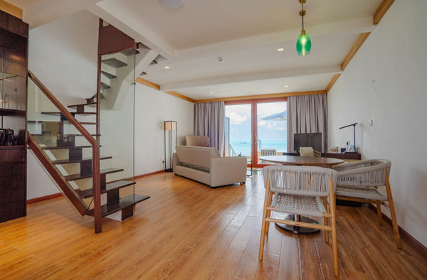 The staircase of a duplex villa at NOOE Maldives Kunaavashi.