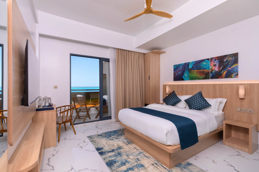 Deluxe Sea View room with balcony at Arrival Beach & Spa, window open to the sea