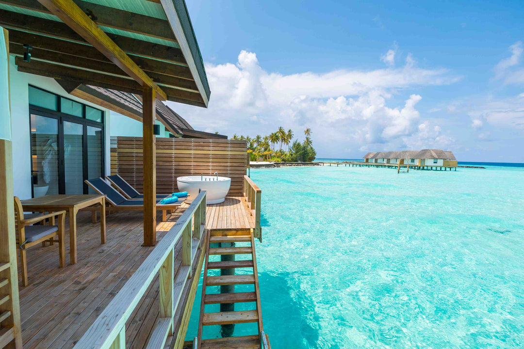 Fushifaru Maldives, Lhaviyani Atoll — a water villa and its timber deck above the lagoon