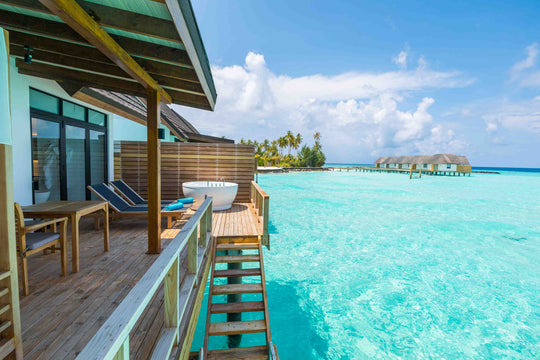 Fushifaru Maldives, Lhaviyani Atoll — a water villa and its timber deck above the lagoon