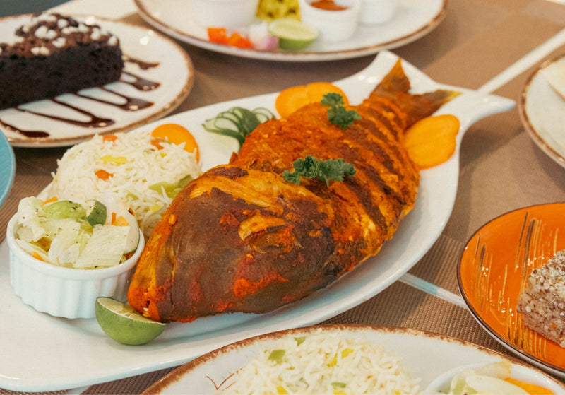 h78 Guraidhoo, South Malé Atoll: a whole grilled fish with rice and salad, served at the restaurant