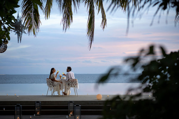 A table laid beside the pool at Huvafen Fushi.