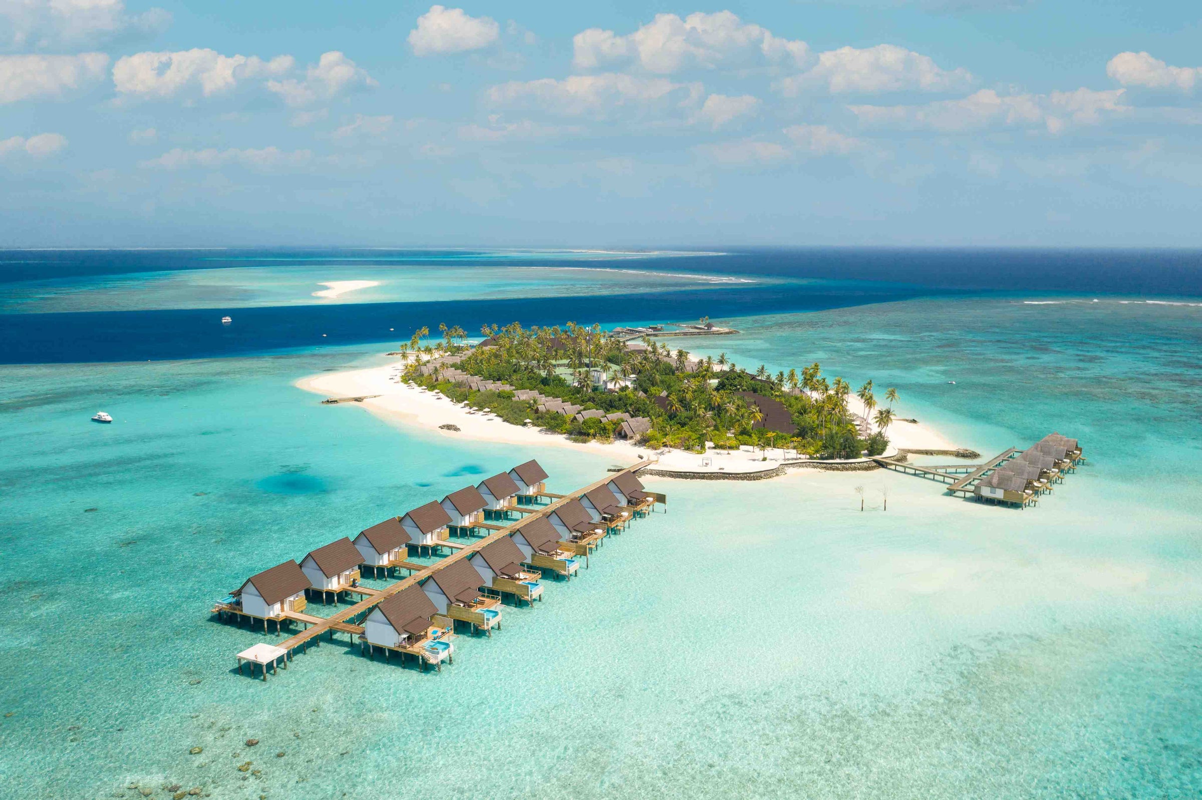 Fushifaru Maldives, Lhaviyani Atoll — aerial view of the island, its jetty and the surrounding lagoon