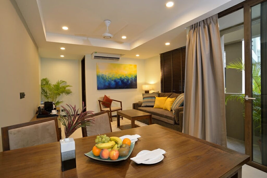 Living area in a suite at The Somerset Hotel with a sofa and armchairs