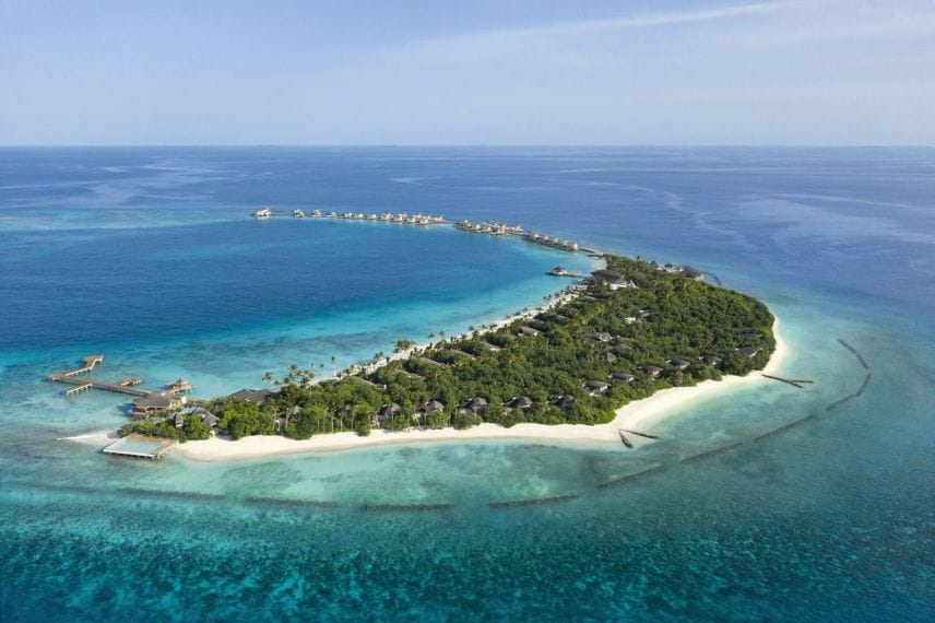 JW Marriott Maldives Resort & Spa from high above, the long curving island in open ocean