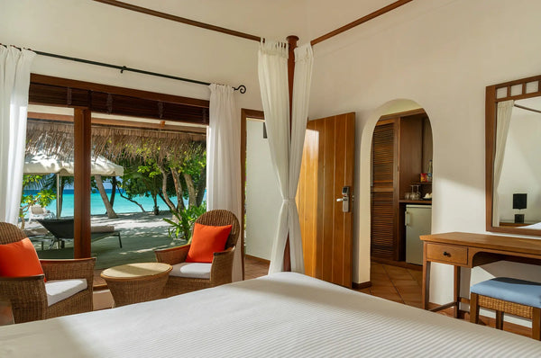 The interior of a Deluxe Beach Villa at Niva Kuramathi Maldives.