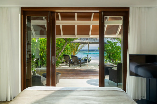 The view from the bed in a Beach Villa at Kandolhu Maldives.