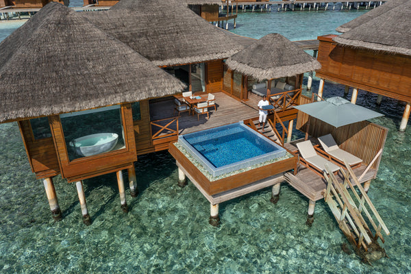 A Lagoon Bungalow with Pool at Huvafen Fushi, seen from above the water.