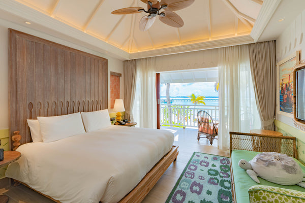 Another view of the bedroom of a Sky Room at SAii Lagoon Maldives.