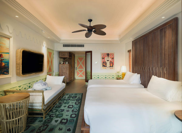 A bedroom in a Two Bedroom Family Beach Room at SAii Lagoon Maldives.