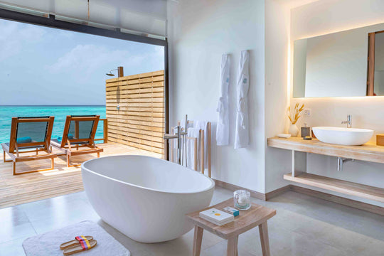 Fushifaru Maldives, Lhaviyani Atoll — villa bedroom opening onto the deck