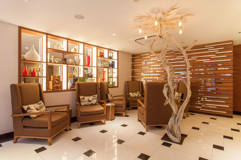 Lobby lounge at The Somerset Hotel with leather armchairs and bookshelves