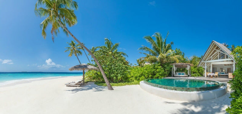 A Beach Pool Villa at Milaidhoo Maldives, seen from the beach.