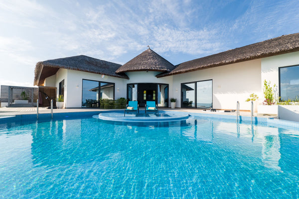 A villa pool at dusk at NOOE Maldives Kunaavashi.