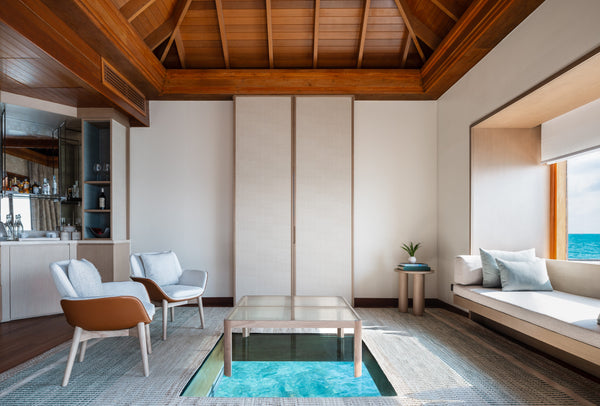 The lounge of an Ocean Bungalow with Pool at Huvafen Fushi.