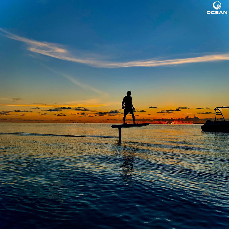 A rider out on the water at sunset at Hard Rock Hotel Maldives.