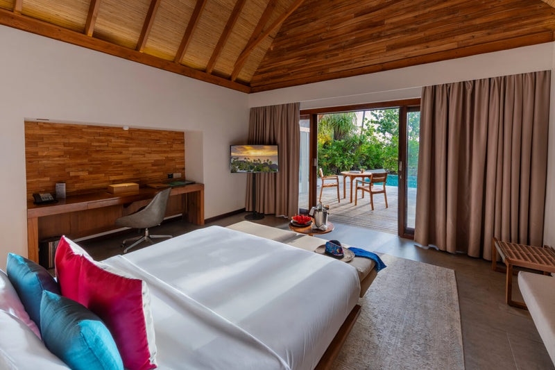 A Pool Beach Villa Sunset at Fushifaru Maldives.