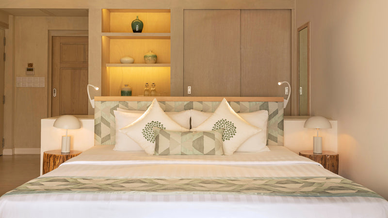 The bed in a Superior Villa at Bandos Maldives.