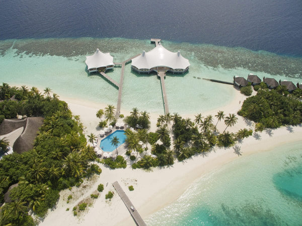 The restaurant pavilions, pool and beach at Safari Island seen from above
