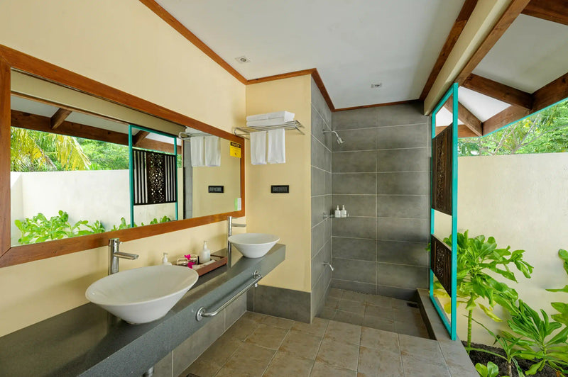 The bathroom of a Sunset Beach Villa at Canareef Resort Maldives
