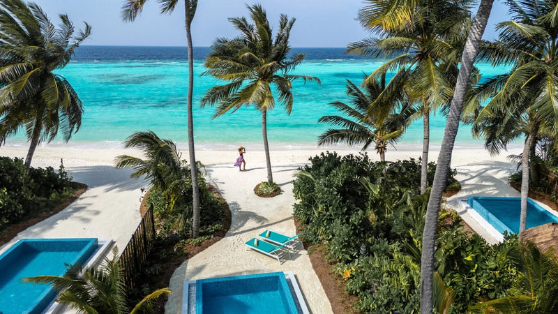 A Sunset Beach Villa with Pool at Nova Maldives seen from the air