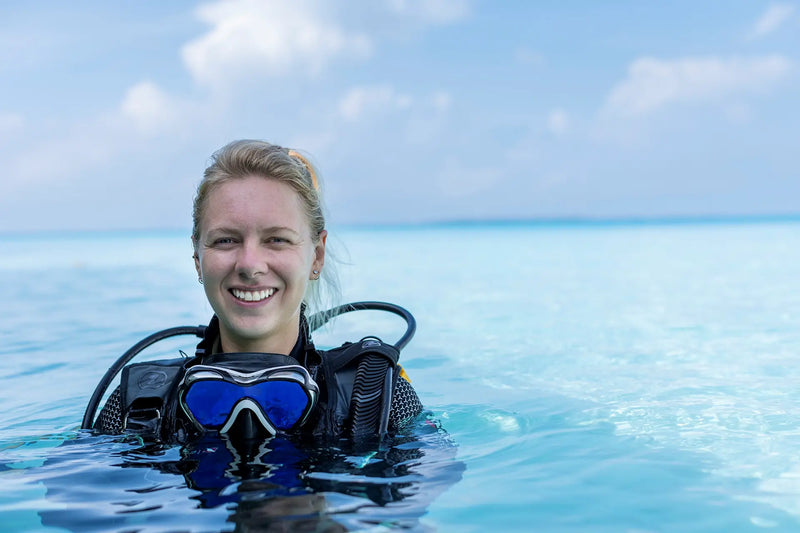 The marine biologist in the water at Niva Velassaru Maldives.