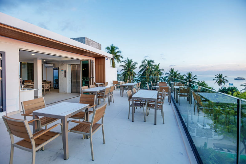 Rooftop dining area at Royal Villa at dusk