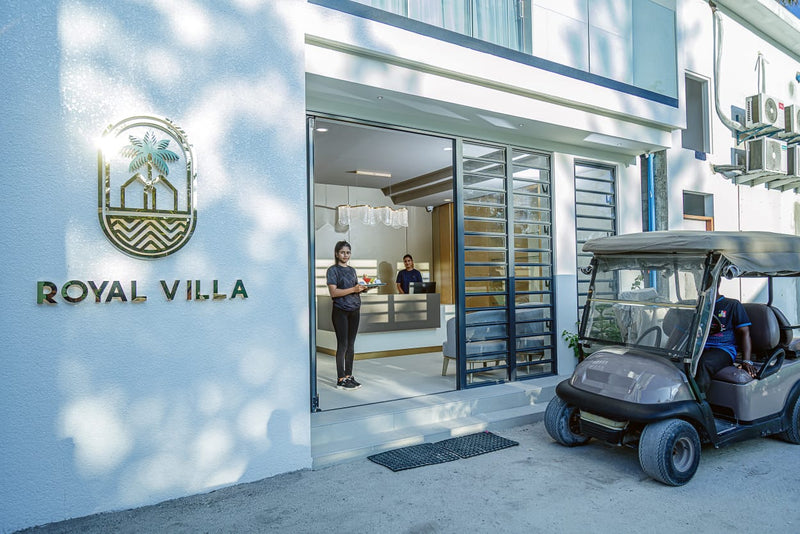 Entrance of Royal Villa on Fulidhoo with a buggy parked outside