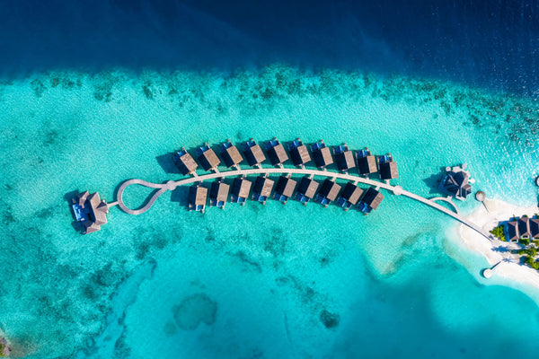 The overwater villa row at NOOE Maldives Kunaavashi from the air.