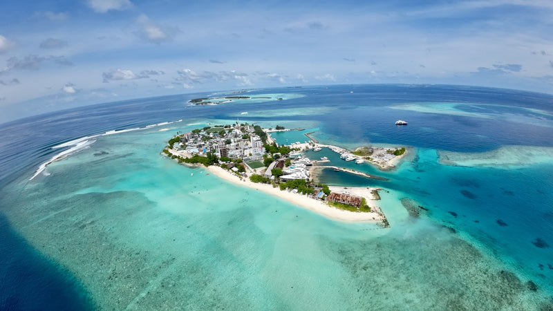 Aerial view of Gulhi, a small local island surrounded by reef and lagoon