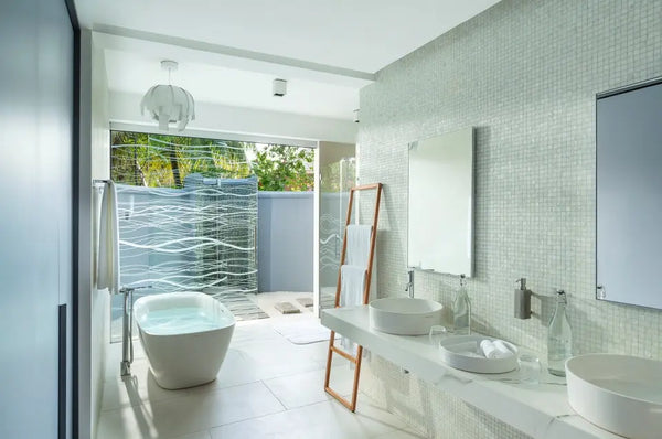 A bathroom in a Two Bedroom Beach House at Niva Kuramathi Maldives.