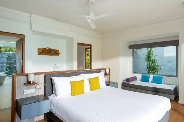 The first bedroom of a Two Bedroom Beach House at Niva Kuramathi Maldives.