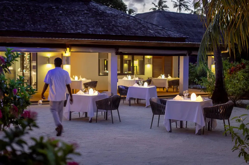 A waiter outside Etesian at Niva Velassaru Maldives.