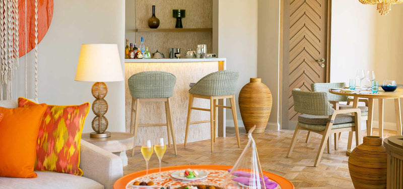 The bar and dining table of a Beach Residence with Private Pool at The Nautilus Maldives.